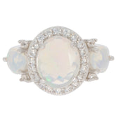 Elegant White Opal Sterling Silver Ring with sparkling gemstone accents, perfect for sophisticated style.